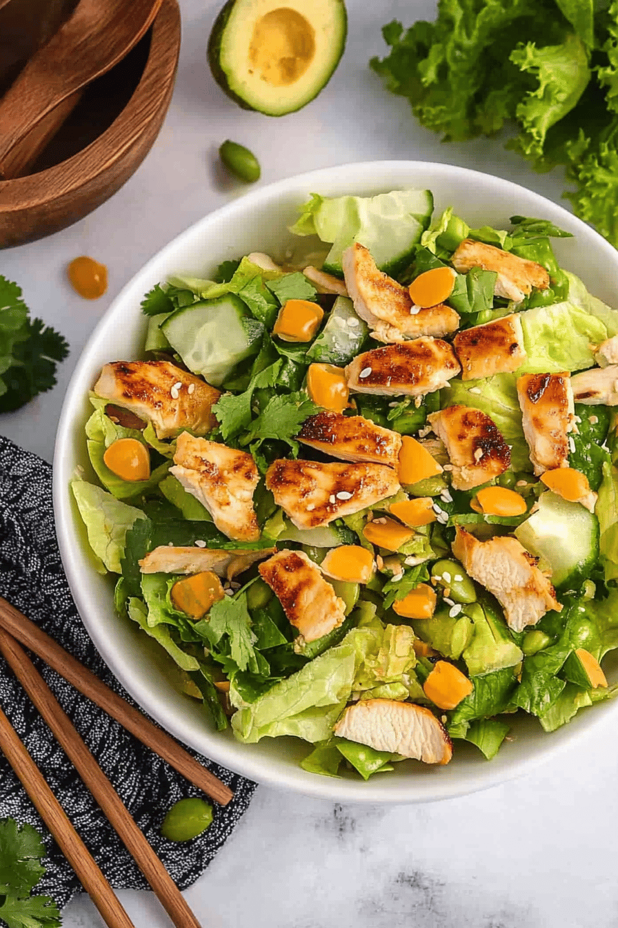 Asian Sesame Chicken Salad Recipe ingredients organized and measured on kitchen counter
