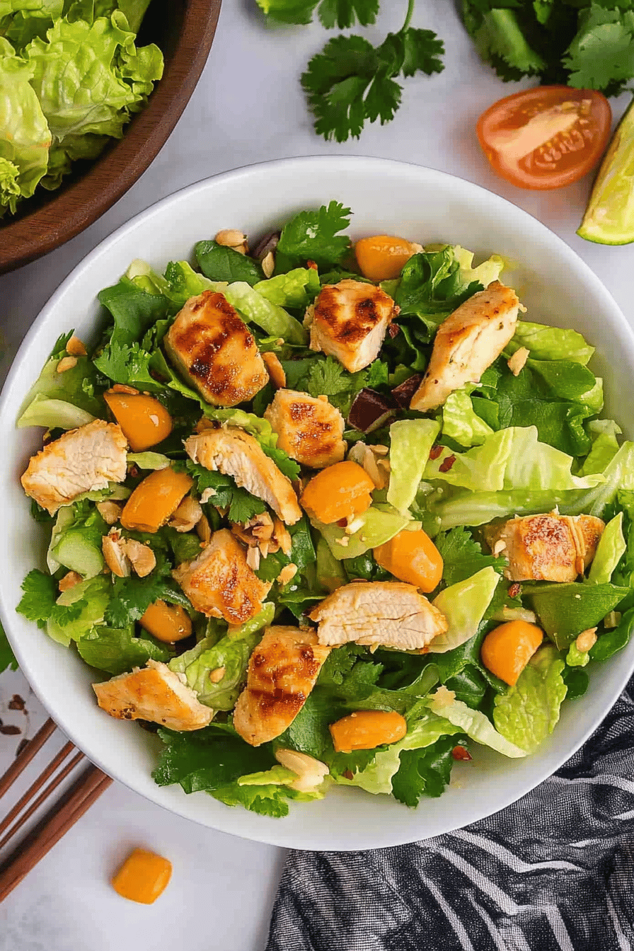 Asian Sesame Chicken Salad Recipe ingredients organized and measured on kitchen counter