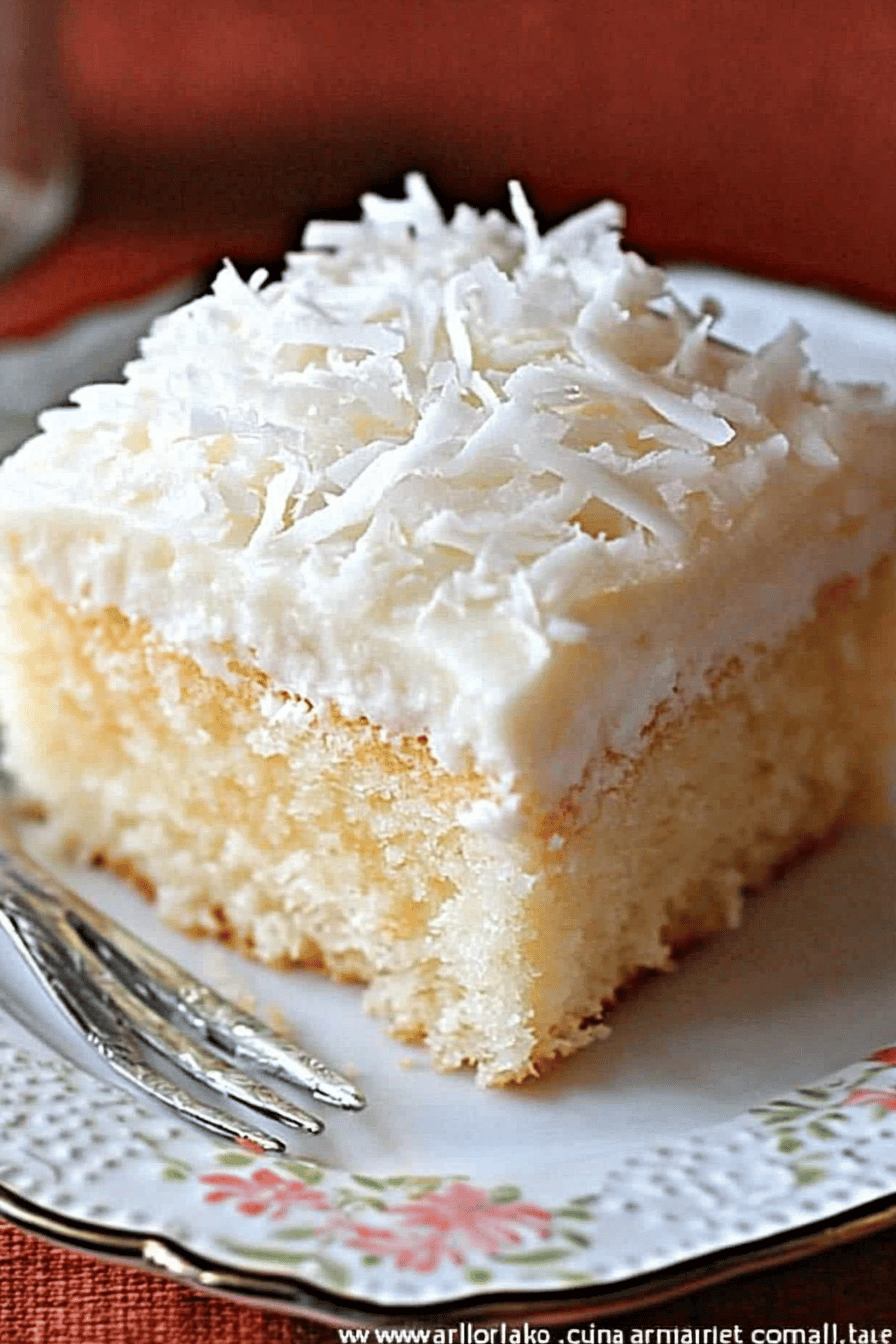 Coconut Cream Cake Recipe slice on plate showing perfect texture and swirl pattern