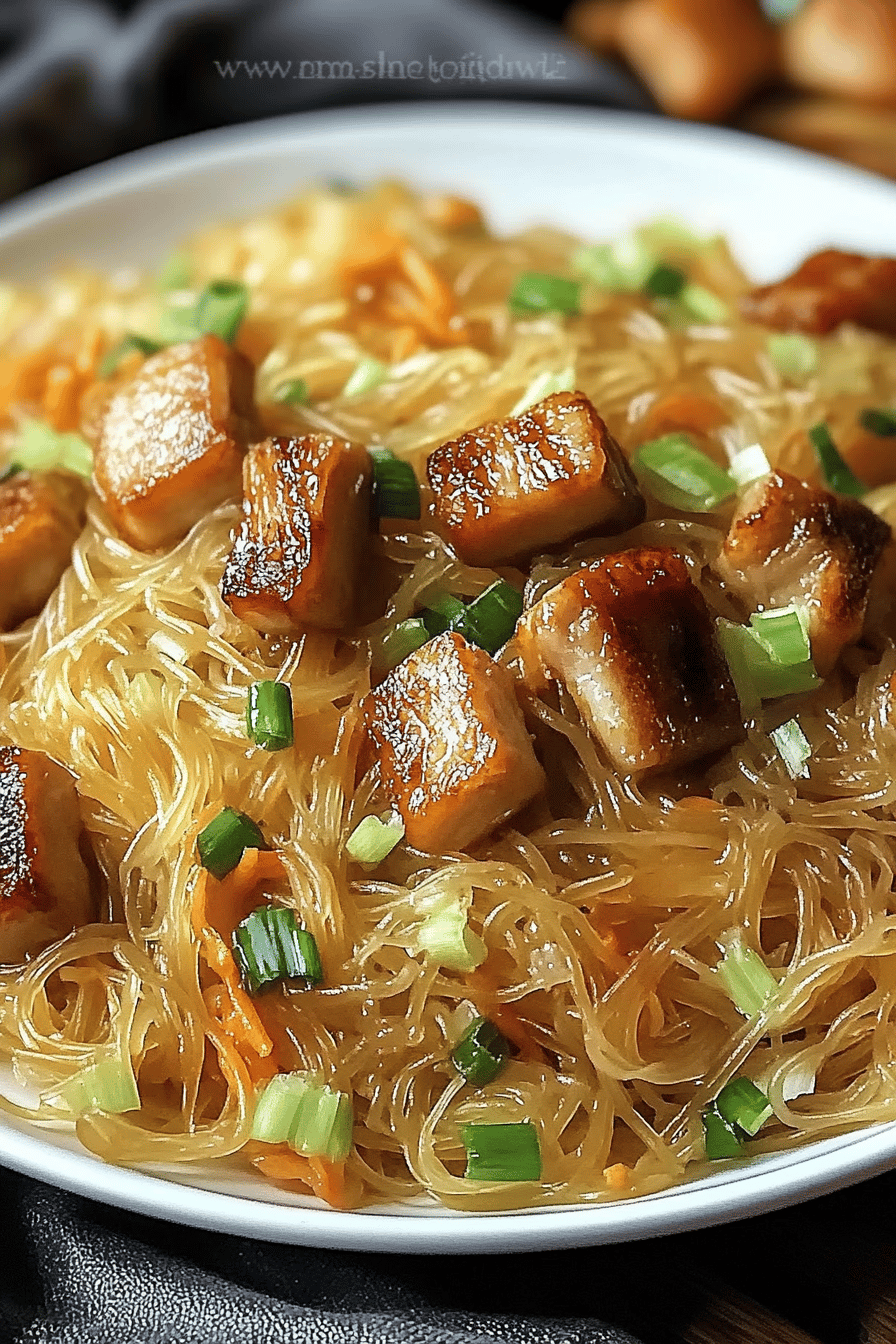 Filipino Pancit Recipe slice on plate showing perfect texture and swirl pattern