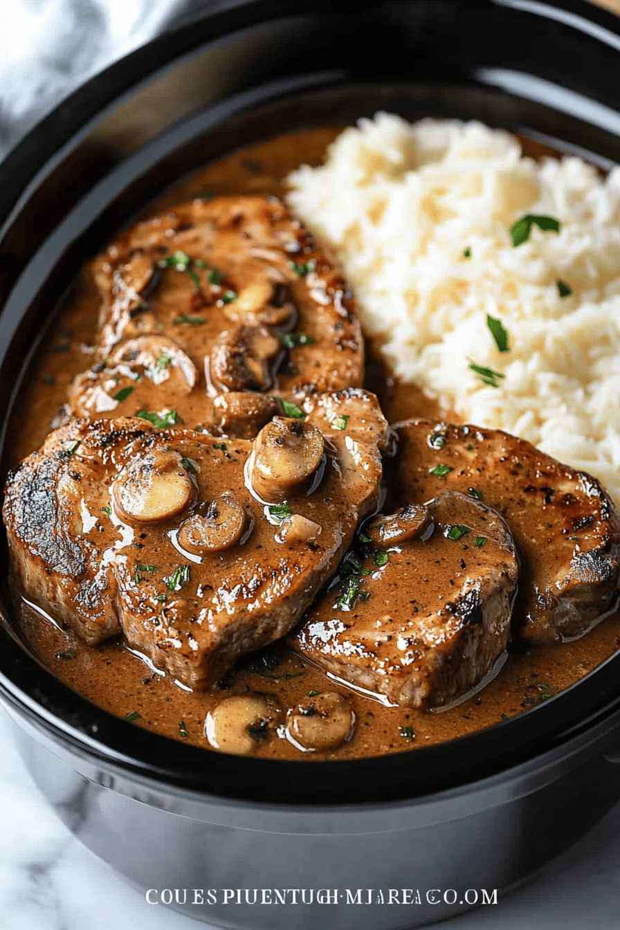 Crock-Pot Pork Chops slice on plate showing perfect texture and swirl pattern