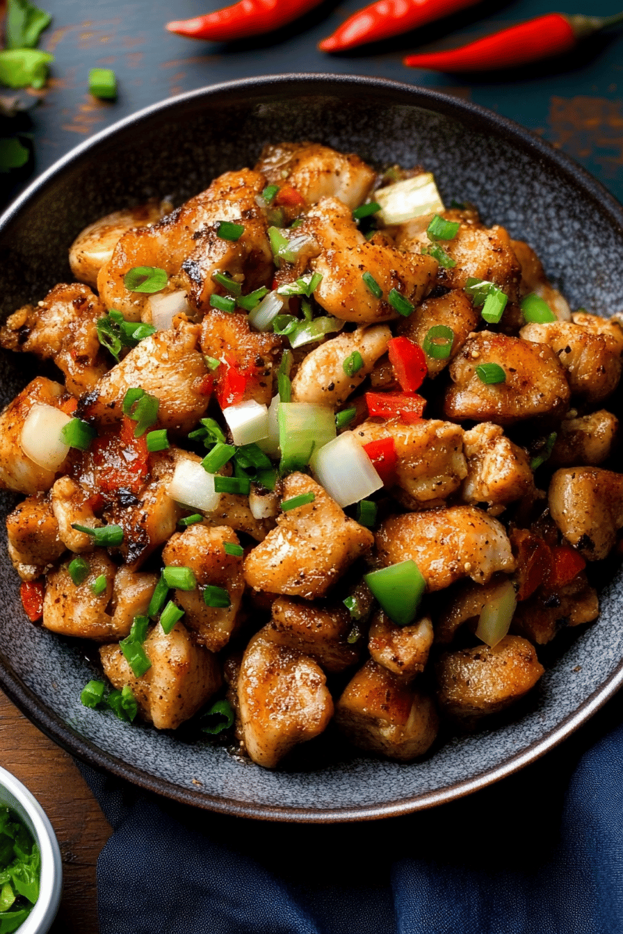 Salt and pepper chicken slice on plate showing perfect texture and swirl pattern