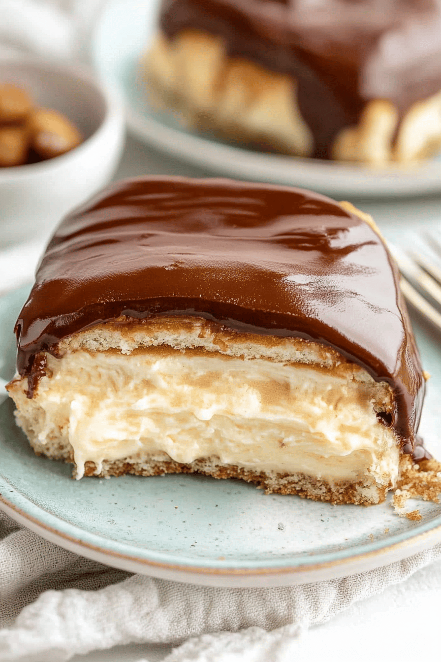 eclair recipe slice on plate showing perfect texture and swirl pattern