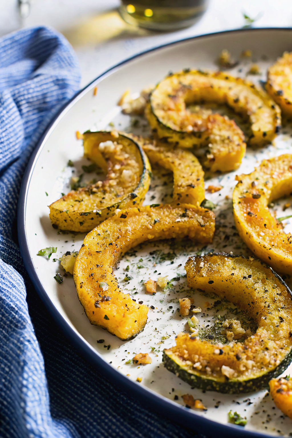 Parmesan Crusted Delicata Squash slice on plate showing perfect texture and swirl pattern