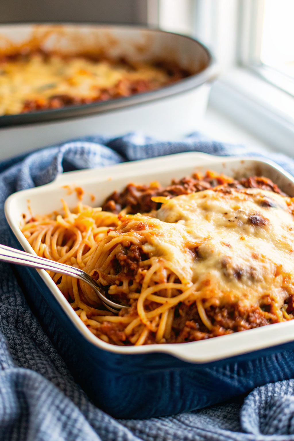 Spaghetti Bake slice on plate showing perfect texture and swirl pattern